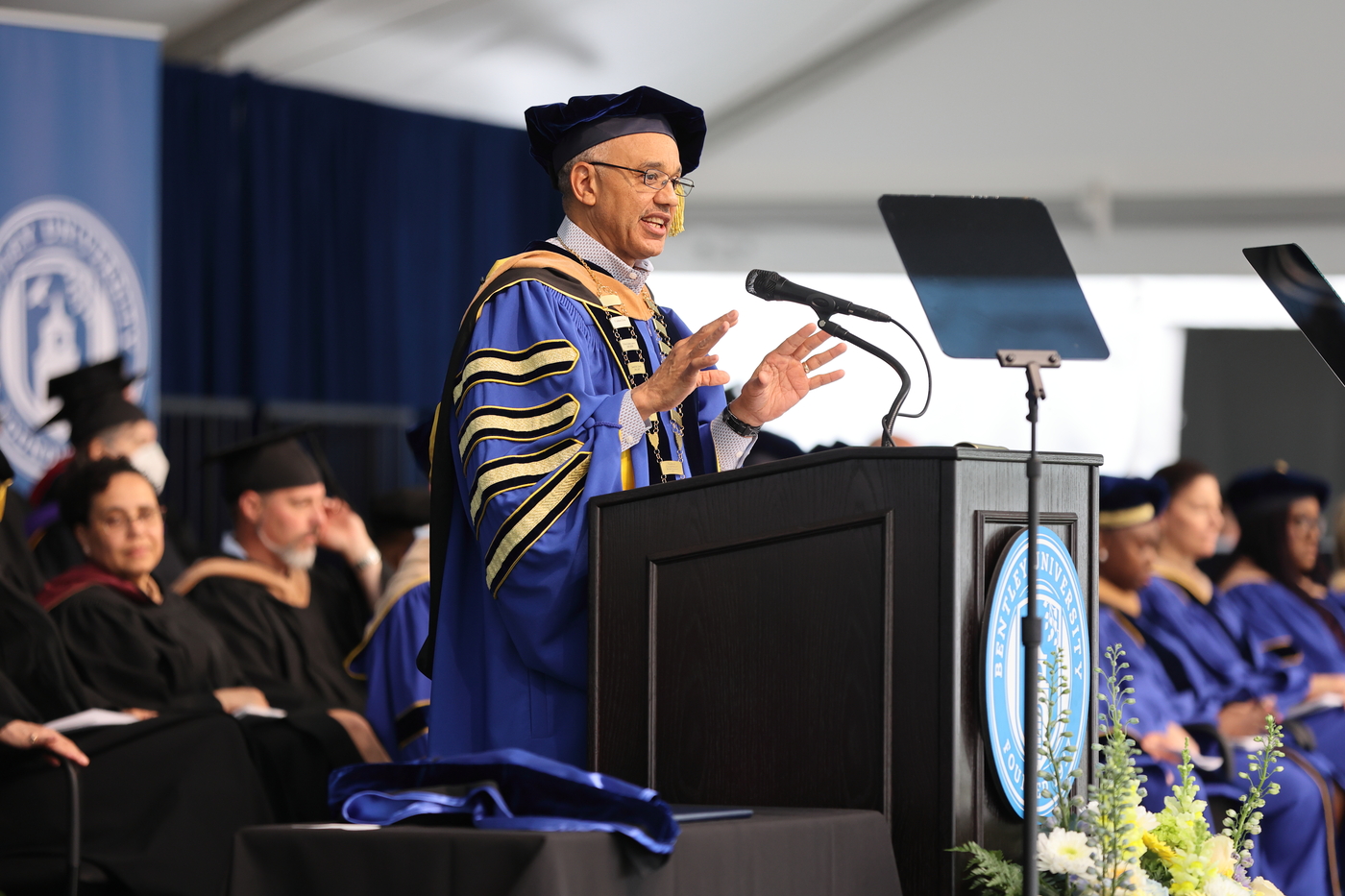 President Chrite speaks at the podium at the 2022 Commencement