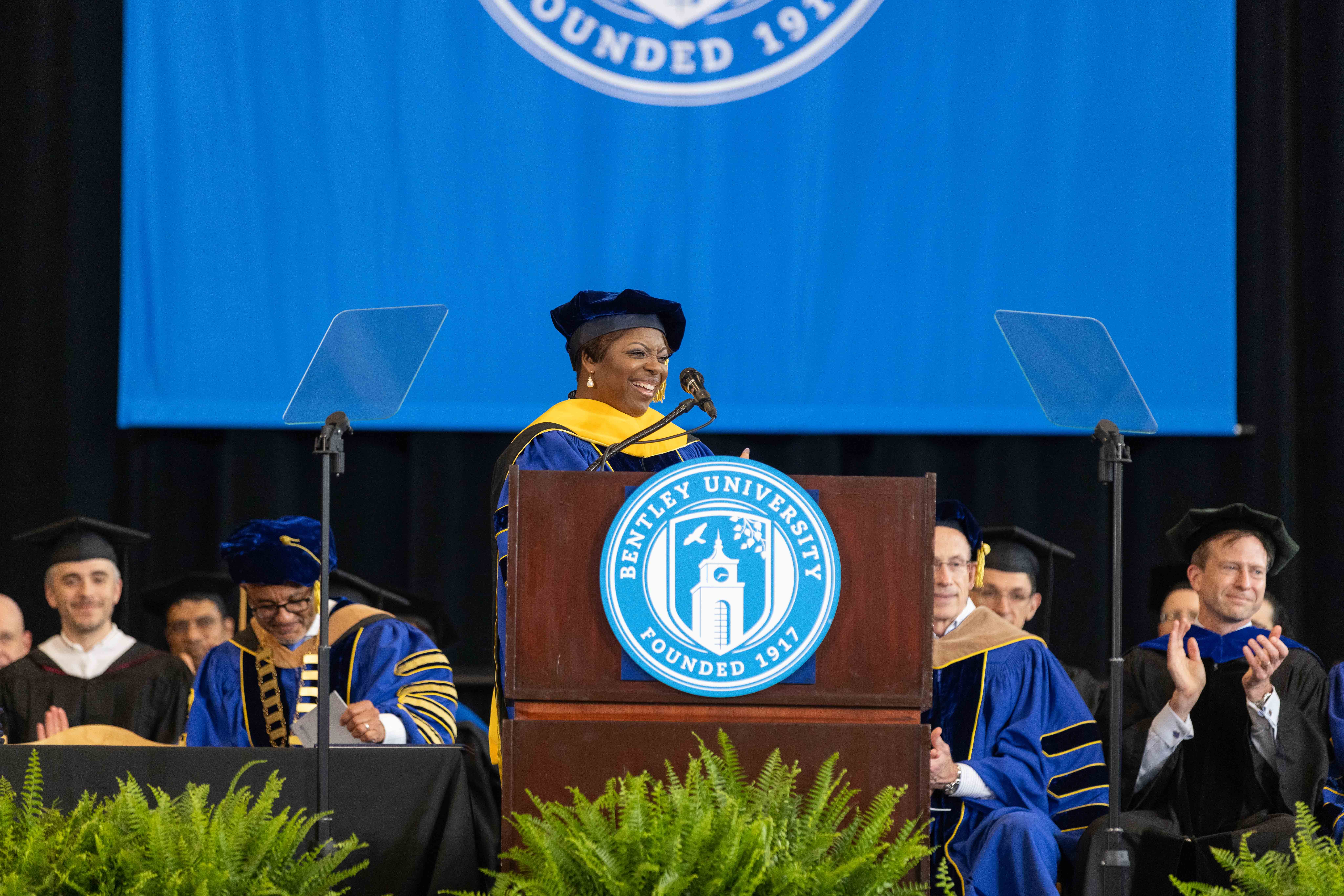 Karan Dyson delivers the keynote speech at the podium