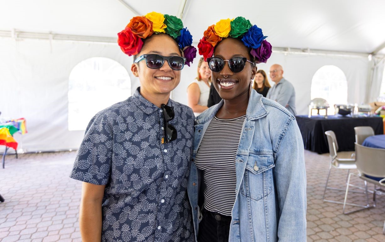 two people wearing floral headband and sunglasses